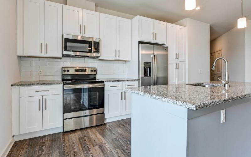 a kitchen with white cabinets